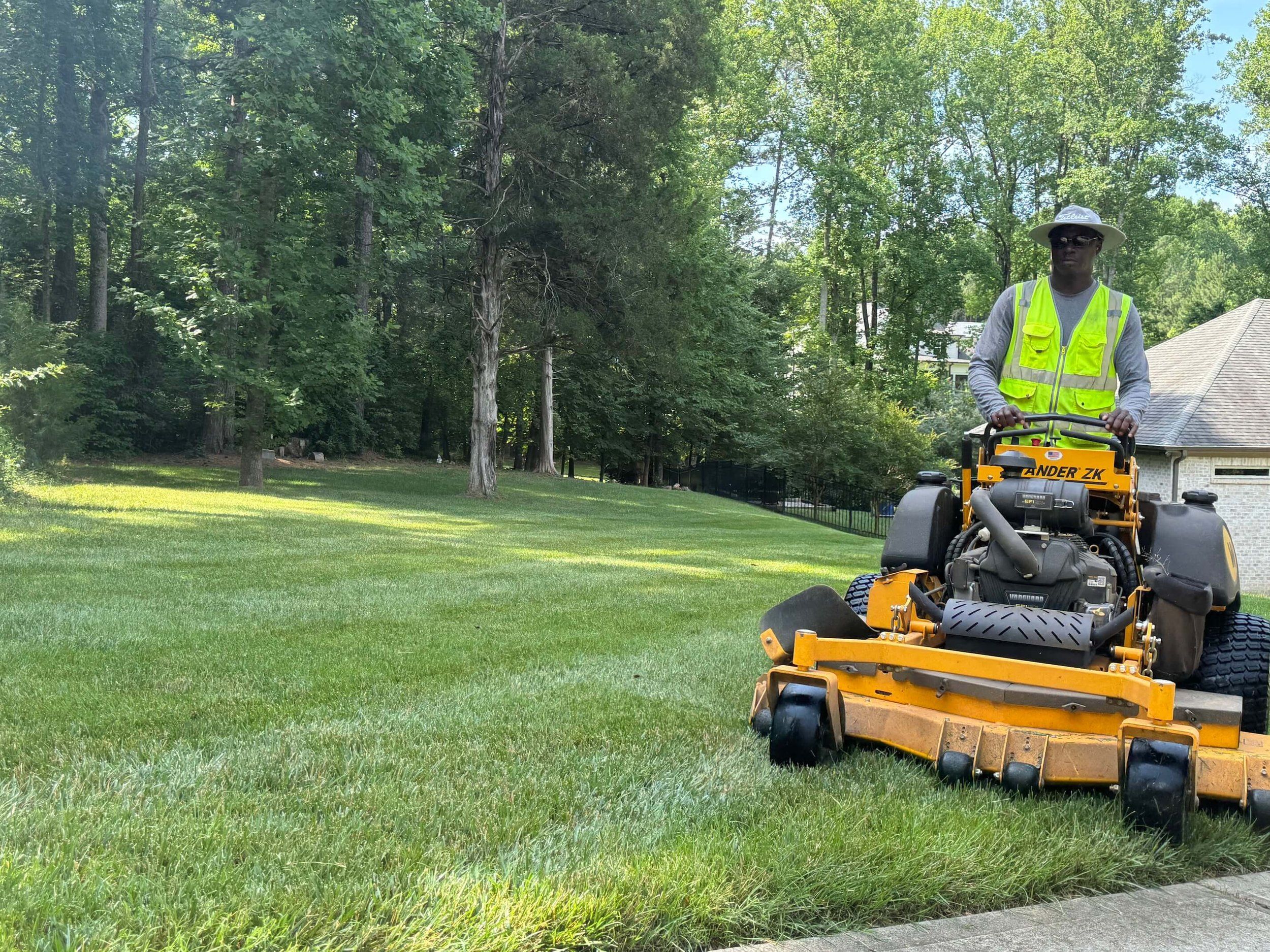 GreenScapes crew mowing a residential lawn in Indianapolis